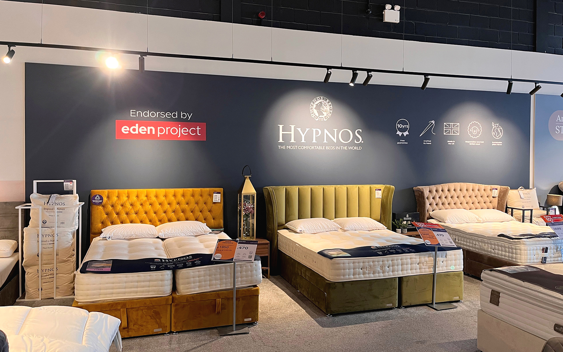 A tension-frame Hypnos graphic in a Bensons store