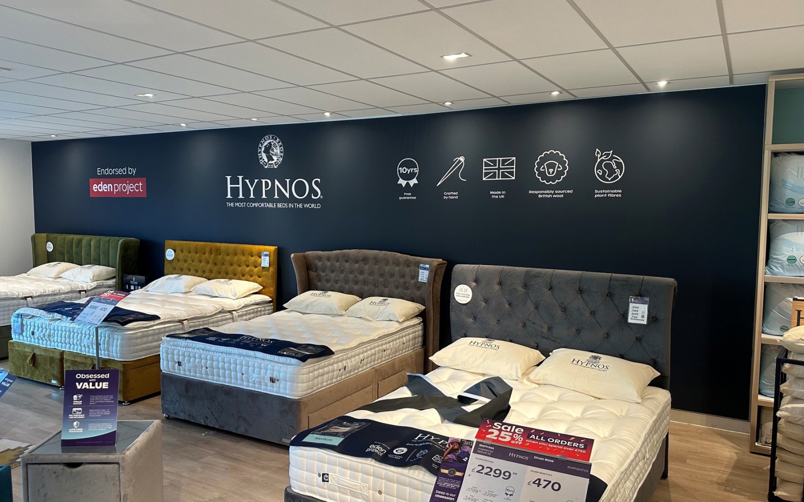A tension-frame Hypnos graphic in a Bensons store