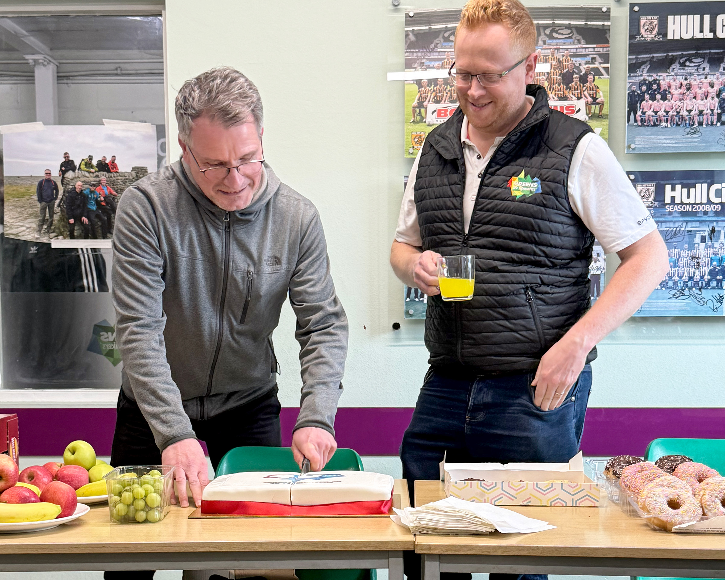 Simon cutting his cake